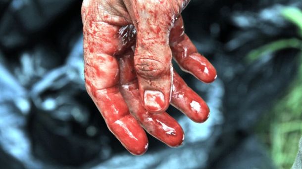 A bloody hand in "Exists."